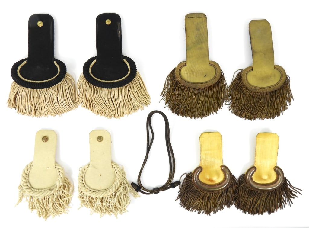 Four pairs of Epaulets: A pair of 71st New York dress epaulets; a pair of white epaulets with eagle general service buttons; two pairs of gold epaulets; and an officer's hat cord. United States C. 1850s-80s