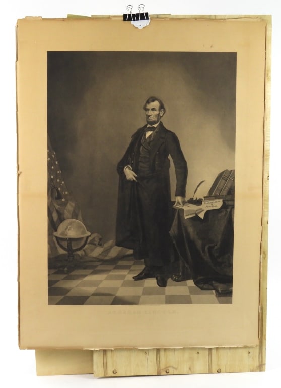 Abraham Lincoln Lithograph: Lithograph of Abraham Lincoln standing, with Constitution, Union, Proclamation of Freedom, books by Jefferson, a flag, and a globe, marked "PUBLISHED BY FISHEL, ADLER & SCHWARTZ, 373 FIFTH AVE. NEW