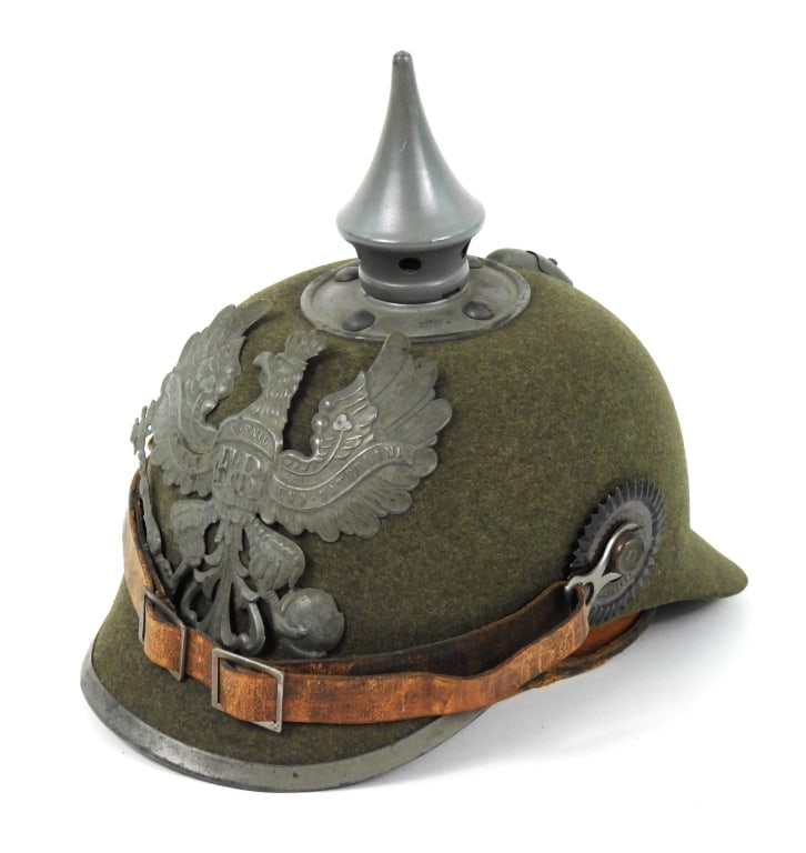 Imperial German WWI Model 1915 Felt Pickelhaube: Field gray felt body, subdued Prussian eagle and hardware, light brown chinstrap, and a dark brown/black leather sweatband. Germany C. 1915 Overall ht. 8"