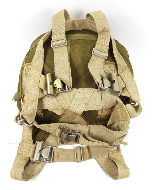 WWII German Parachute and Bag: Coarse khaki parachute carry bag with lift the dot snaps, an inner bag containing the parachute and tracers, as well as the aluminum buckles and straps. Germany C. 1939-45