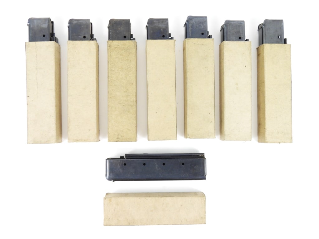 Eight Seymour Products Thompson SMG Magazines: Eight Thompson SMG 20 round magazines in pasteboard sleeves, all marked "THE SEYMOUR PRODUCTS CO/SEYMOUR, CONN". United States Overall lg. 6 1/4" Disclaimer and lot information: Many states restrict