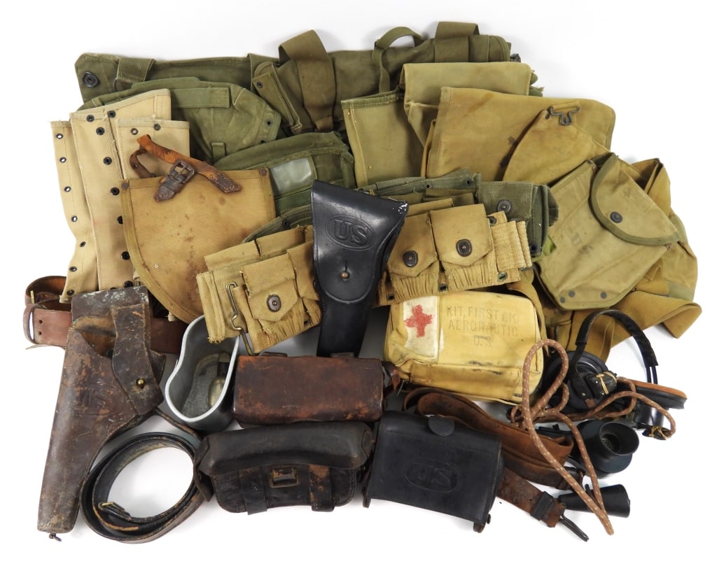 Group of Military Gear: Large group of military web gear; leather ammunition pouches; and other miscellaneous equipment.