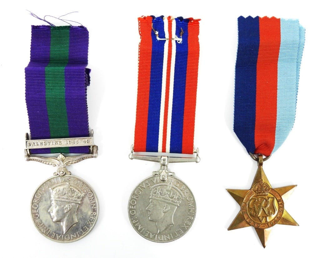 Three WWII English Service Medals: An I'D General Service Medal " Capt. W.J. Martin R.A." with Palestine 1945-48 clasp. Captain Martin served in the Royal Regiment of Artillery until Jan 16th 1947. Medal appears to be silver but not te
