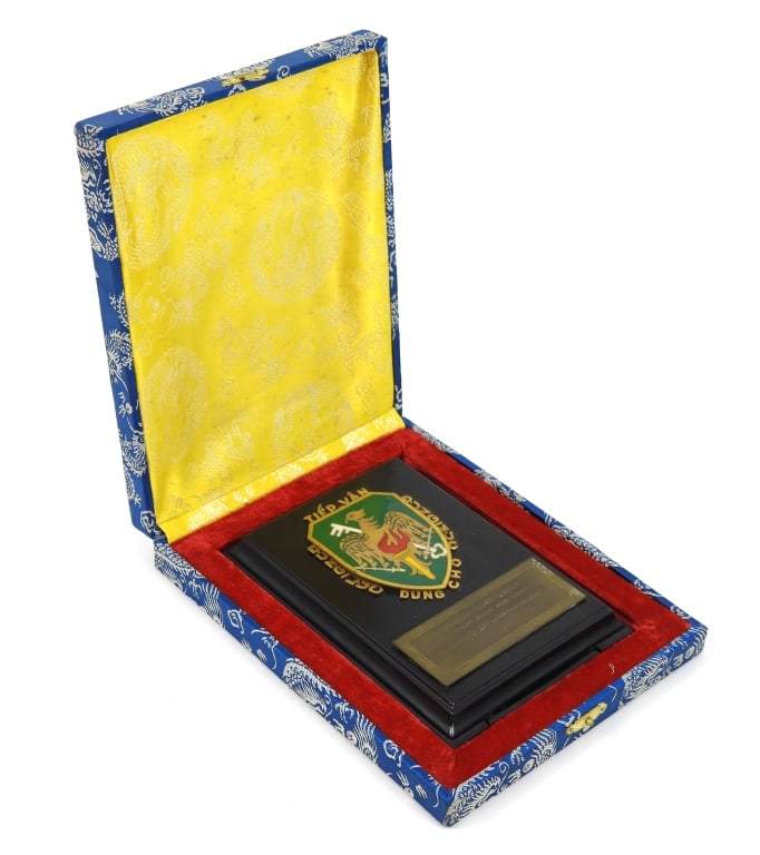 Vietnam-Era Gen. Alden K. Sibley Presentation: Cased desk plaque with Vietnamese unit logo and a brass plate marked "TO GENERAL ALDEN K. SIBLEY/DEPUTY CHIEF MAAG FOR LOGISTICS/FROM RVNAF LOGISTICS COLLEGE/1961." Vietnam C. 1961 Overall ht. 6 1/2"