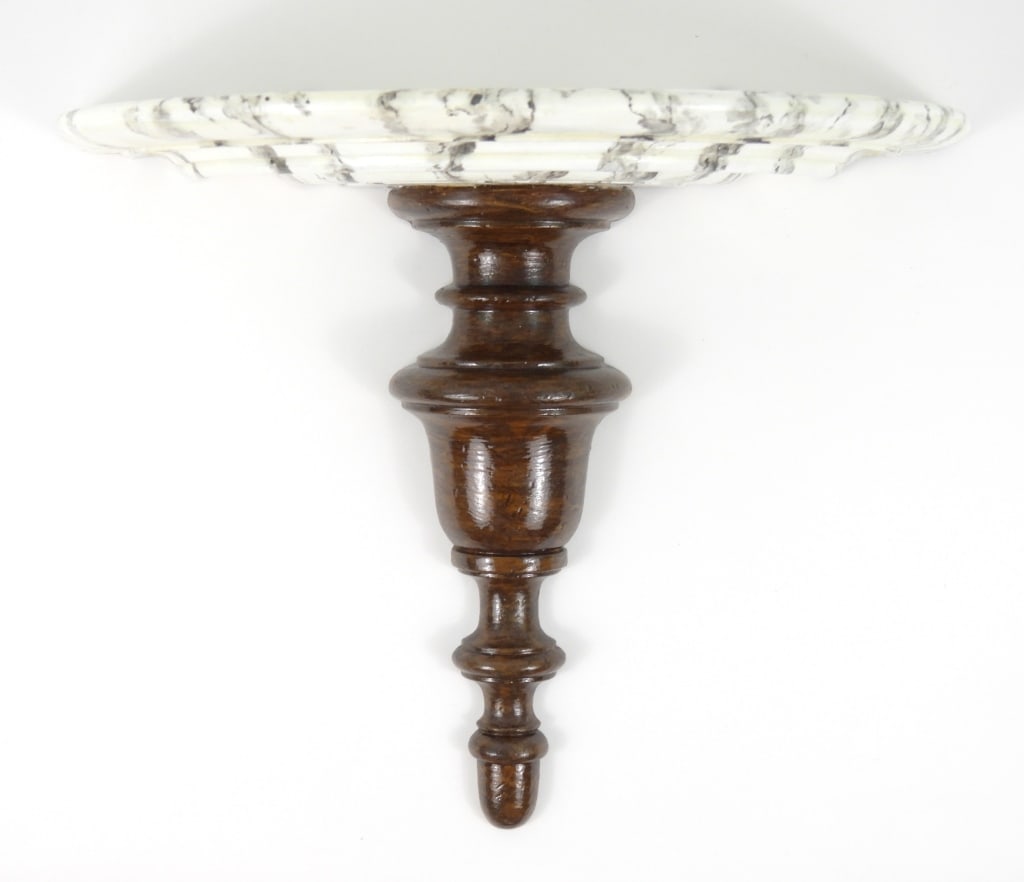 Pedestal Wall-Mounted Shelf with Faux Marble Top: Wooden wall-mounted pedestal shelf with nicely painted faux marble top, with 2 brass brackets for hanging. Shelf is approx. 16" X 8", and approx. 13" tall.