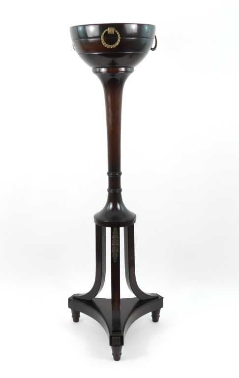 Vintage Mahogany Pedestal Plant Stand: A nice vintage, possibly early 20th century, mahogany pedestal plant stand. Three short, turned legs supporting a triangular base, from which extends 3 curved legs, supporting a central turned column