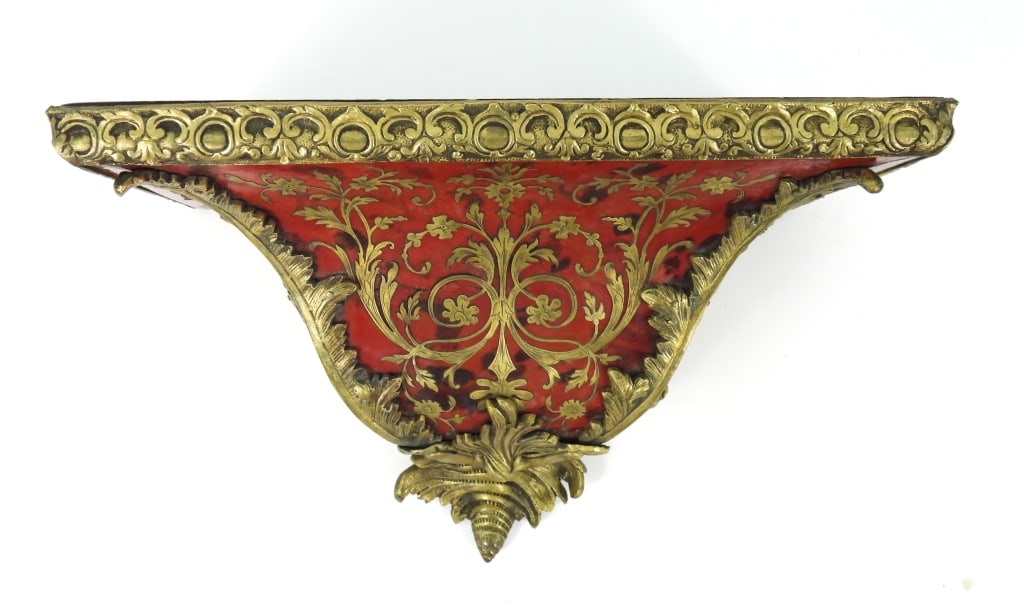 Gilt Bronze Mounted Boulle Marquetry Wall Shelf: Continental, early 20th century, rectangular wooden shelf unit, with gilt bronze foliate inlay and appliques, and 2 jappaned brass hangers for attaching to a wall.Approx 13 3/4" x 8 3/4" x 7 1/2"