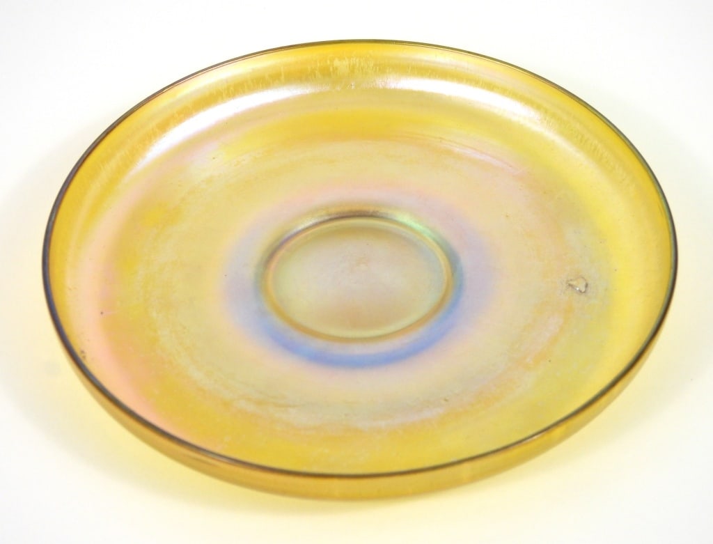 Louis Comfort Tiffany Favrile Glass Dish: Favrile glass dish with tall rim display vibrant blue and pink iridescent shifts. Measures 5-78" diameter.