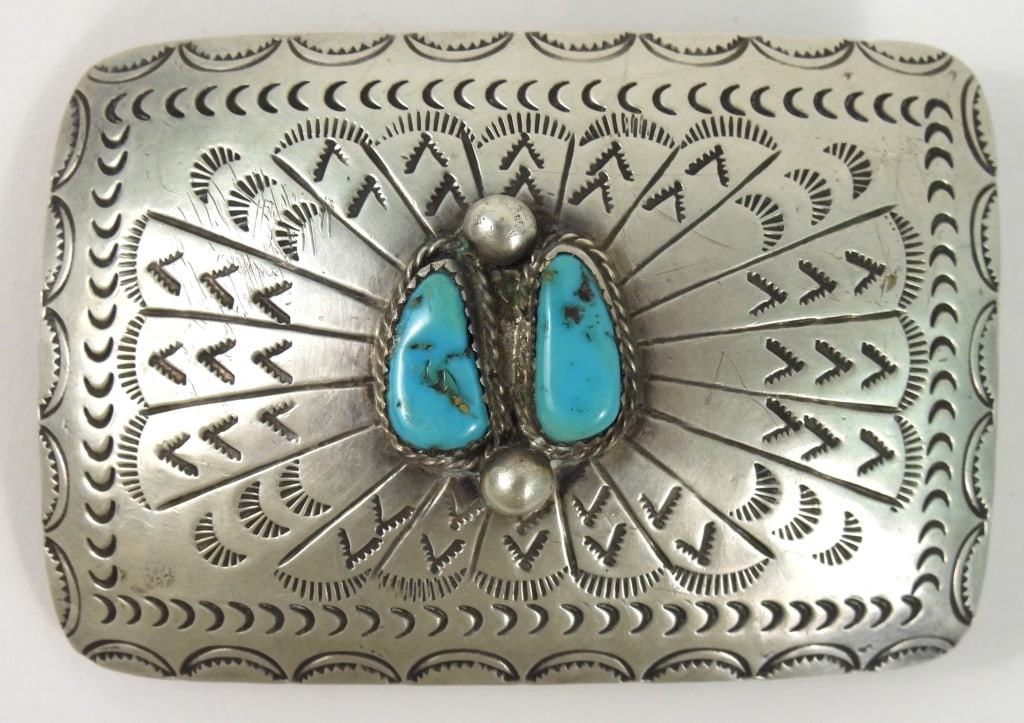 Navajo Signed D.C. Thomas Belt Buckle: Mid century sterling silver buckle stamped "NAVAJO / Sterling / D.C. / Thomas" on reverse. Native American Darlene C. Thomas made with double Turquoise stones and tooled designs. Measures 2" x 3".