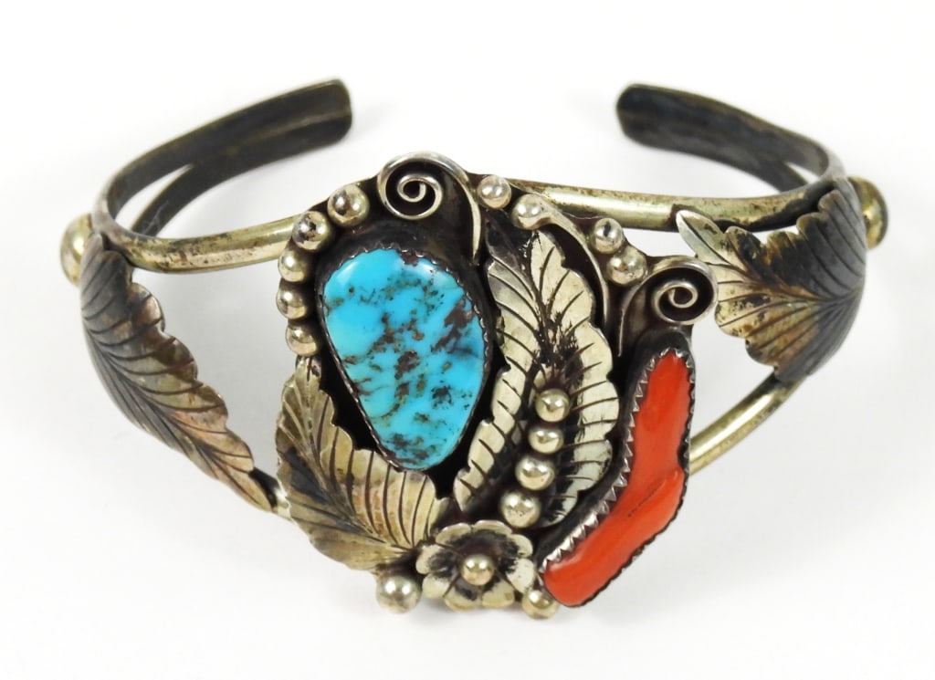 Navajo Signed Phil Chapo Sterling Bracelet: Stamped "STERLING" with the "PHIL CHAPO" stamp. His classic Native American design form with signature feather leafs. Weighs approx. .78 ozt.