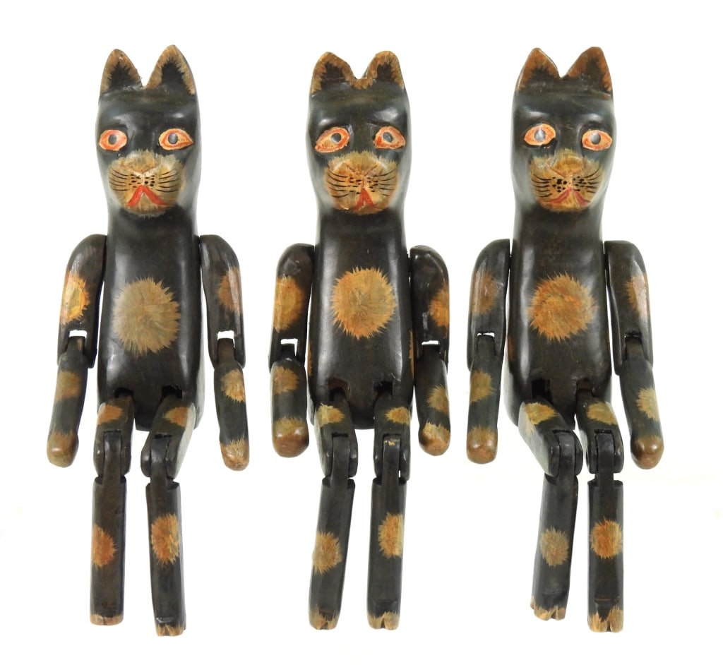 3 Contemporary Wood Carved Folk Art Cats: Having articulated arms and legs with hand paint. Age unknown. Each measure 12" long.