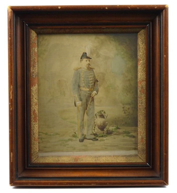 Framed Image 19th Century Military Officer: Nicely framed hand painted image of a militia officer in uniform with a shako, epaulets, sword belt, and sword.United States C. 1870s-80s Frame. 16-1/4" x 14-1/2".