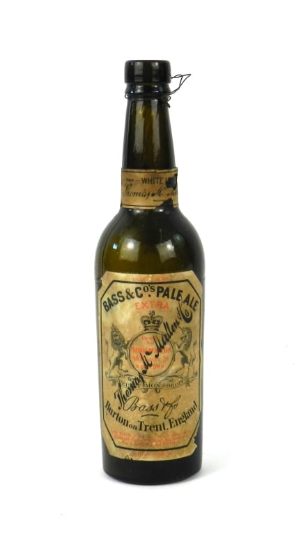 Bass & Cos. Pale Ale Paper Label Bottle Antique: Scarce 19th or early 20th century original paper labeled three piece molded olive color White Label Bass Beer company beer bottle, still retains the wire for the cork. Label is signed Thomas McMullen