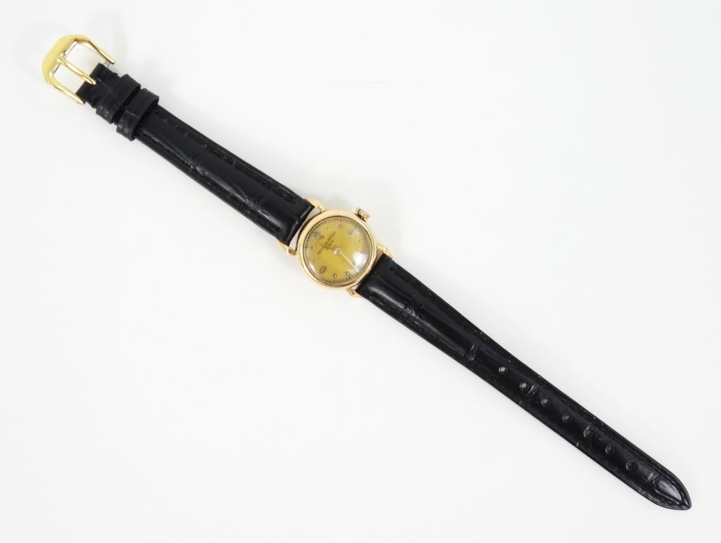 Patek Philippe & Co. Ladies Cocktail Dress Watch: Unique antique unrestored manual movement watch that appears to be the early Calatrava model, having an 18K gold case Art Deco style dial with raised quarter hour numbers and the scarce horizontal 9
