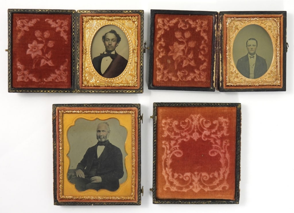 Group of 3 Antique Photographs: Group of 3 19th century Ambrotype photographs in cases, including a 6th plate of a seated man with a hand-tinted pink face and hands, a 9th plate portrait of a young man with an advertisement on the b