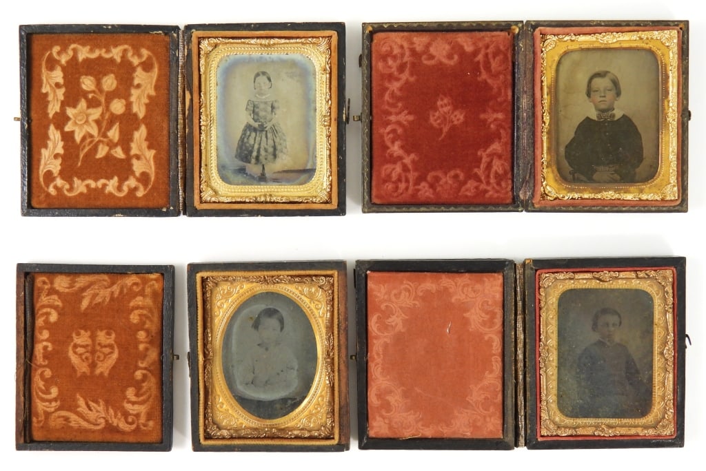 Group of 4 Antique Child Portrait Photographs: Group of four 9th plate portraits in wooden cases of children, including a boy with hand-tinted pink cheeks, with white collar and cravat, identified as "George B. Weaver, age 4 years, 1859", a young