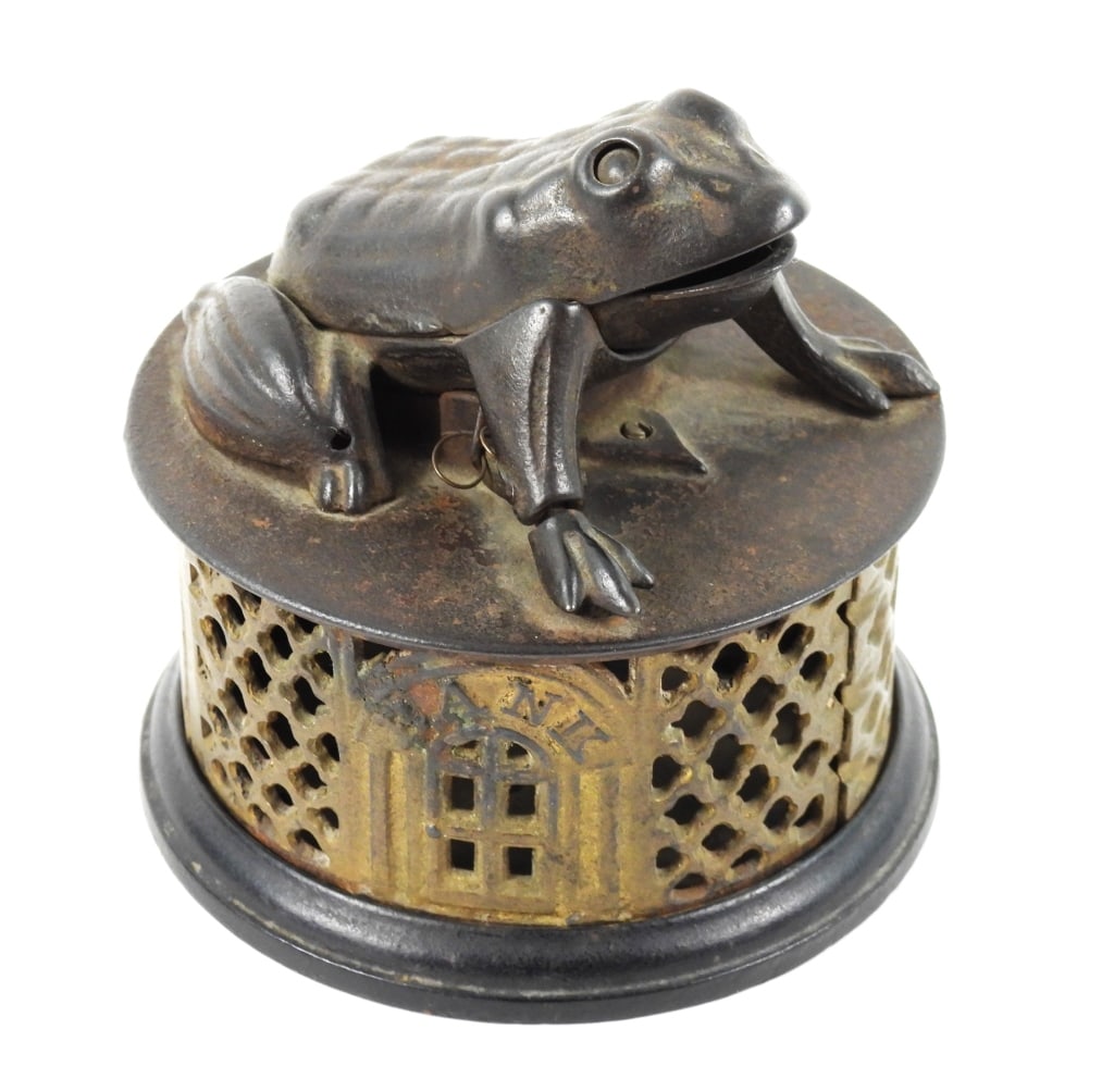 19th Century Frog On Lattice Bank: J&E Stevens Company Cromwell Ct. cast iron mechanical bank. Gold lattice body. Works properly. Measures 4-3/8" diam x 4-3/8" high.