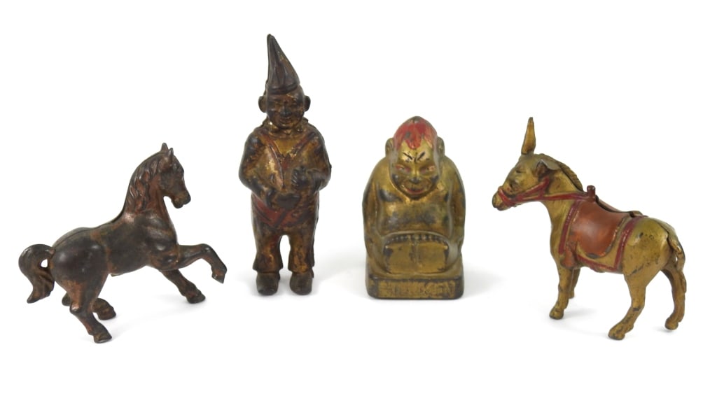Grouping Of Antique Cast Iron Banks: A "Billiken Good Luck" figure bank with gold paint 4" high. A gold color Donkey 4-1/2" long. A heavily worn painted Horse 4-1/2" long. A circus clown figure in gold paint that is 6-1/4" high.