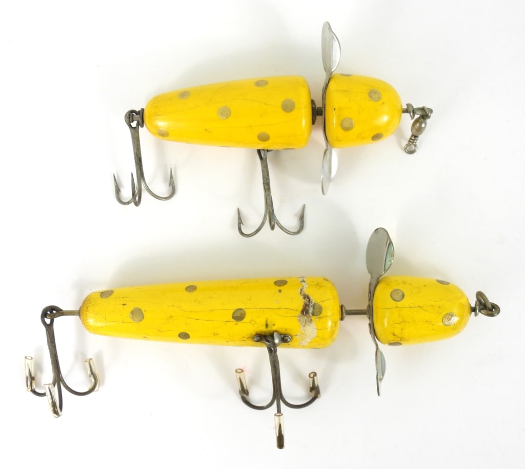 Two Pflueger Globe Bumble Bee Lures: Each are yellow with gold dots. Large one appears to be the 3750 series that measures 5-1/2" long. It has paint cracks and dings from use. The smaller one measures 4" long and is better condition