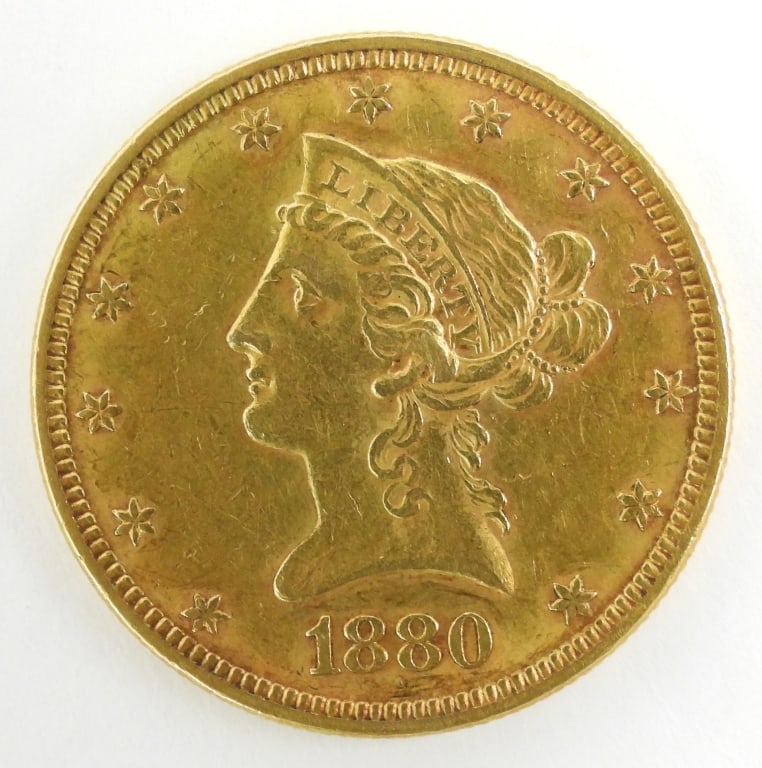 1880 U.S. Gold $10 Liberty Head Eagle: United States $10 circulated coin in good condition with face and headdress wear. No mint stamp.
