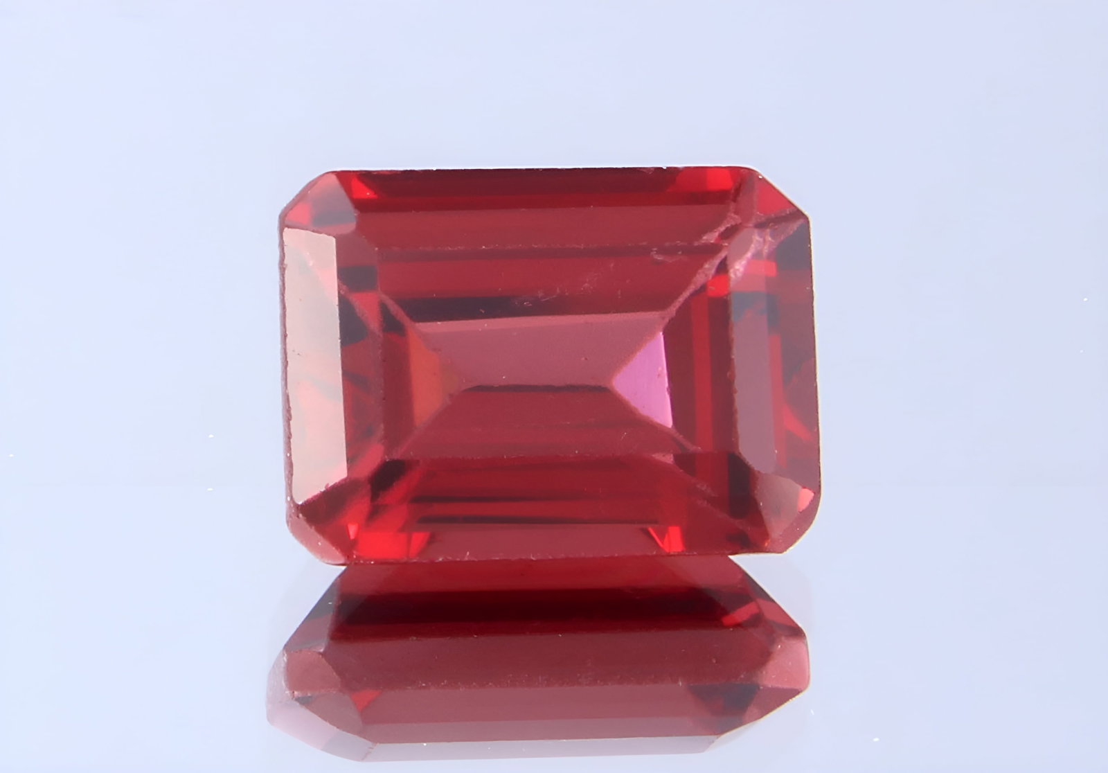 Top 2.18 Cts Natural Almandine Garnet: Gemstone : Natural Almandine GarnetShape and cut : Emerald CutOrigin : BrazilWeight : 2.18 caratsMeasurements : 8x6 mm [Calibrated]Color : RedTransprancy : TransparentTreatment : No TreatmentClarity :