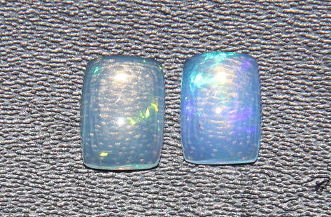 Lovely 1.12 Cts Natural Ethiopian Opal Set: Gemstone : Natural OpalShape and cut : Rectengular CabochonWeight : 1.12 CaratsMeasurements : 7x5 mm, Color : White,Number of Stone : 2Transparency : TranslucentTreatment : No TreatmentOrigin : Ethiop