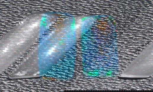 Stunning 1.15 Cts Natural Ethiopian Opal Set: Gemstone : Natural Ethiopian OpalShape and cut : Rectengular CabochonWeight : 1.15 CaratsMeasurements : 9x5 mm, 8.17x4.61x2.66Color : WhiteNumber of Stone : 2Transparency : TranslucentTreatment : No T