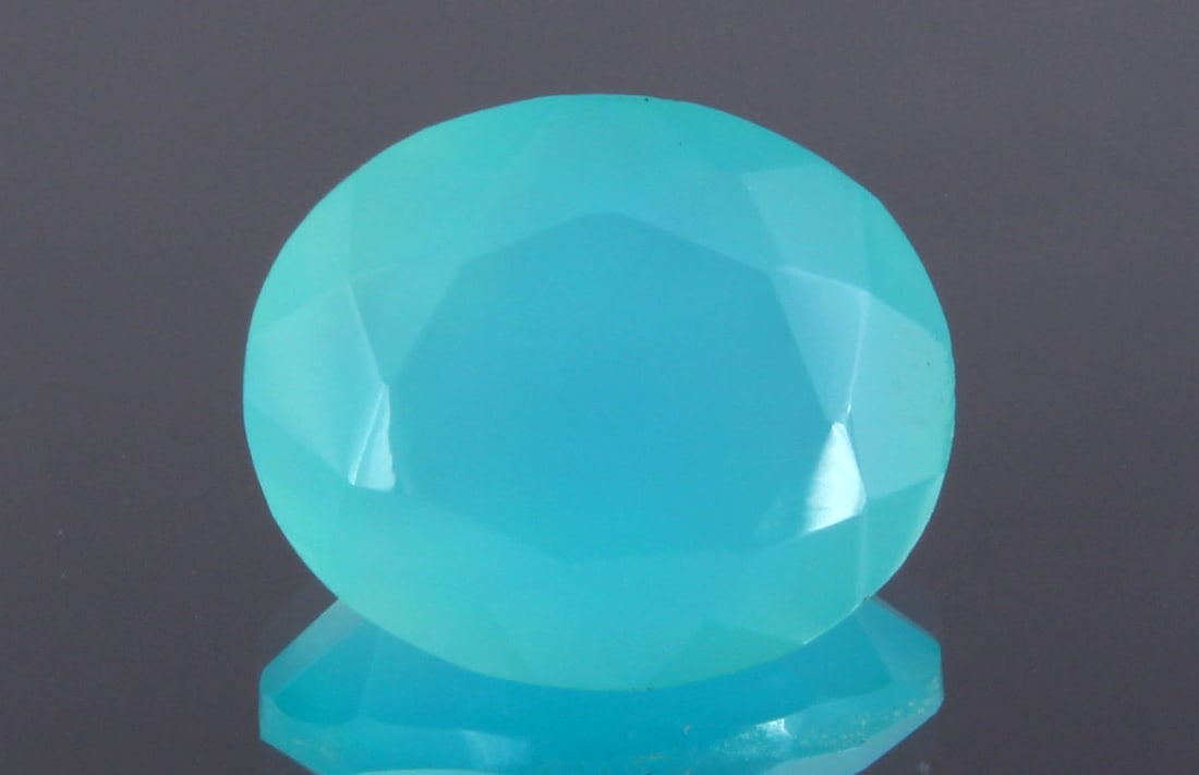 Beautiful 4.10 cts Natural Paraiba Blue Chalcedony: Gemstone : Natural Chalcedony Origin : IndiaWeight : 4.10 caratsDimensions : 12x10 mmShape : Oval CutColor : BlueTreatment : HeatedTransparency : Translucent