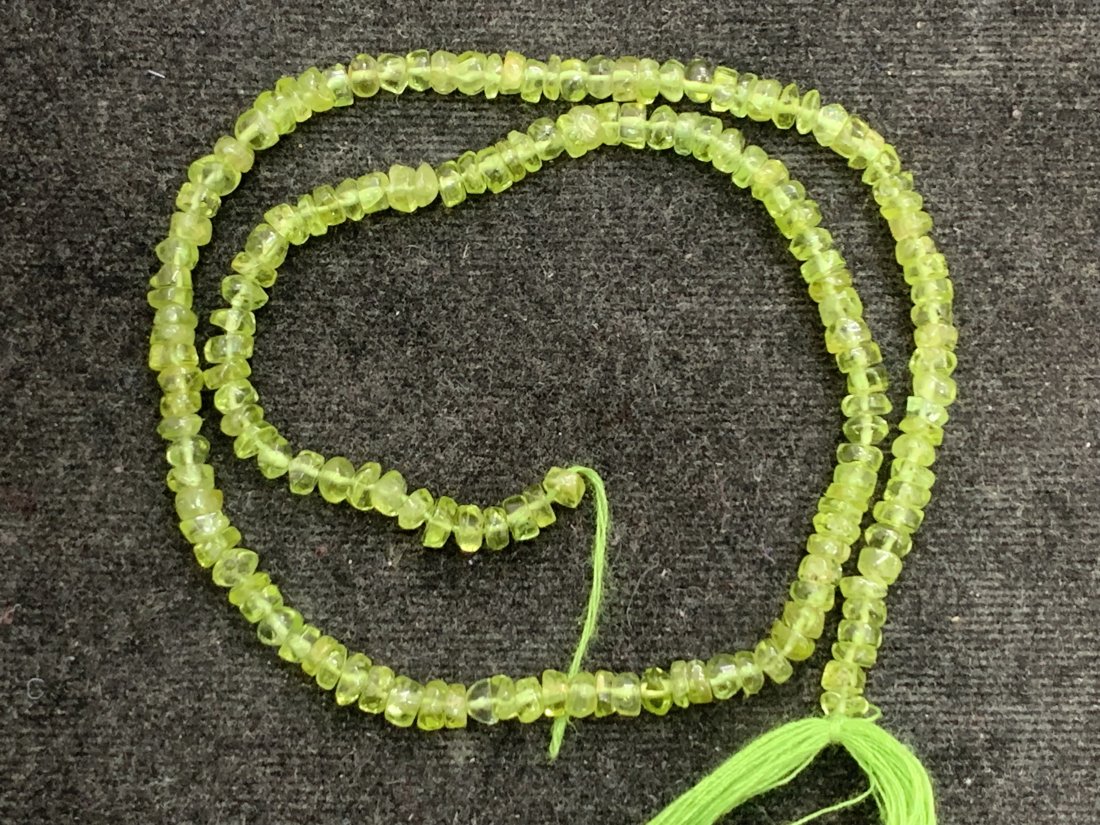 Top Green 56.90 cts Natural Peridot Beads: Gemstone : Natural PeridotWeight : 56.90 caratShape : Round and freeform BeadsDimensions : 4x4 mm, Color : Green Length: 14, InchesOrigin : IndiaTreatment : No Treatment Transparency : Transparent"