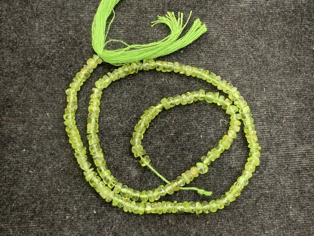 Top Green 57.50 cts Natural Peridot Beads: Gemstone : Natural PeridotWeight : 57.50 caratShape : Round and freeform BeadsDimensions : 4x4 mm, Color : Green Length: 14, InchesOrigin : IndiaTreatment : No Treatment Transparency : Transparent"
