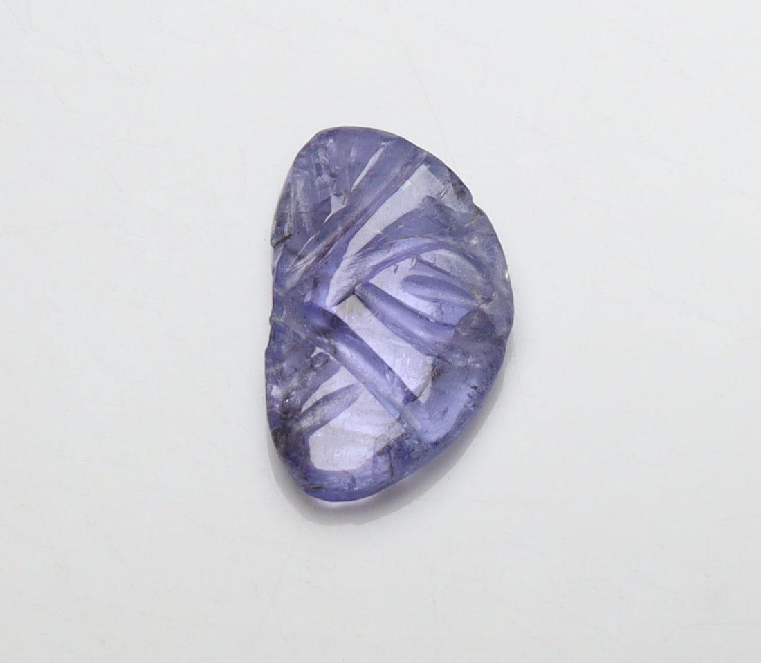 Delightful " Natural Tanzanite Carving " 1.82 Cts Natural Tanzanite Carving: Gemstone : Natural Tanzanite CarvingOrigin: TanzaniaWeight : 1.82 caratsDimensions : 12x7 mmShape/Cut: Fancy Carving CutColor : Violetish BlueTransparency: transparentTreatment: none