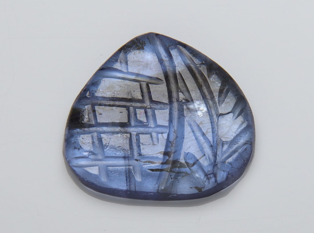 AA Color Natural Tanzanite Carving -3.35 Cts: Gemstone : Natural TanzaniteOrigin: Tanzania Weight : 3.35 carats MeasurementsMeasurements : 11.20x12.39x2.18 mm Shape/Cut: Pear Carving Color : Violetish Blueish Blueish Blue Transparency: transparen