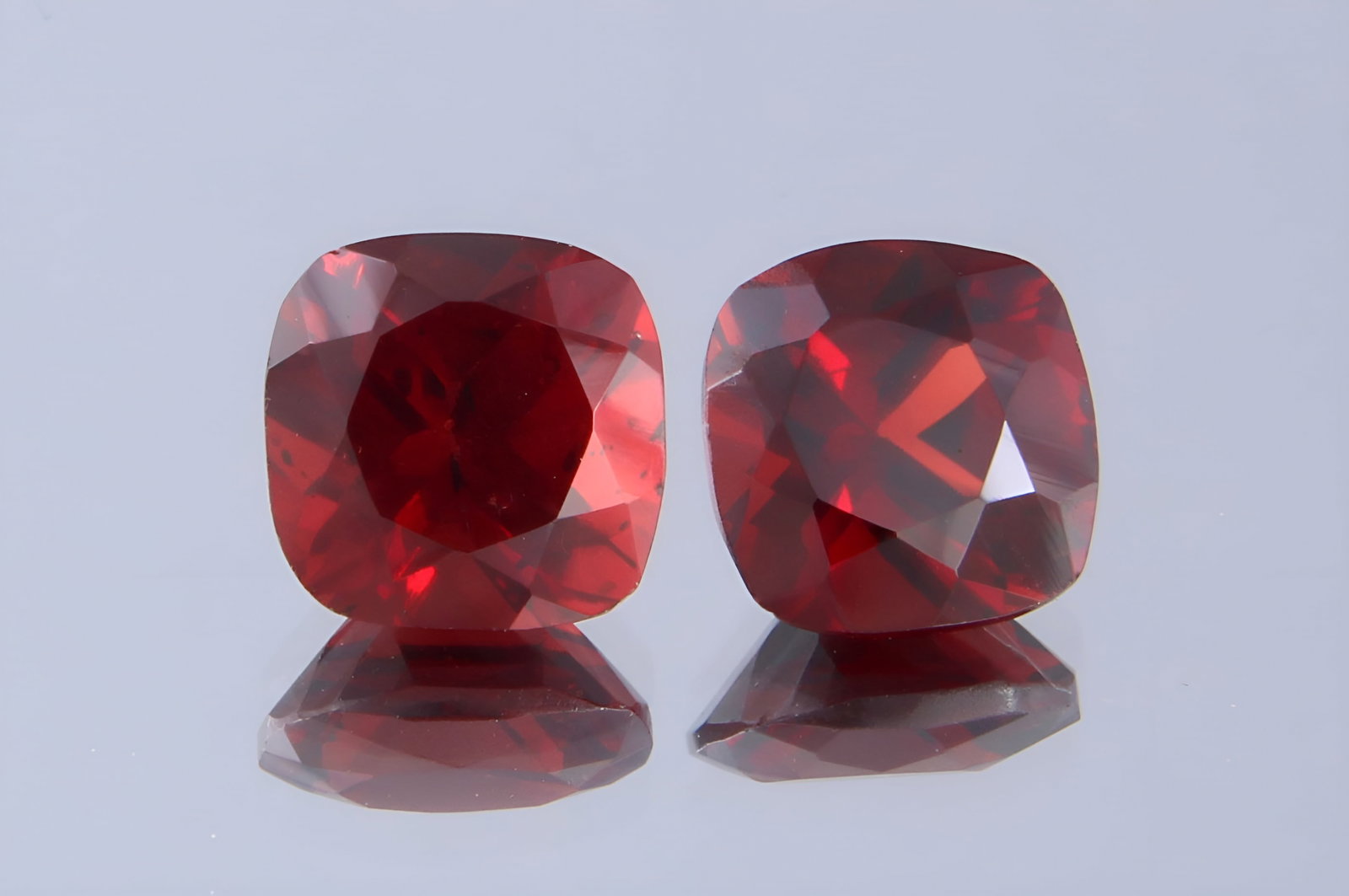 Stunning 2.35 Cts Natural Almandine Garnet Pair: Gemstone : Natural Almandine Garnet Shape and cut : Square Cushion Origin : Brazil Weight : 2.35 carats Measurements : 6x6 mm [Calibrated] Color : Red Number of Stone : 2 Transparency : Transparent Tr