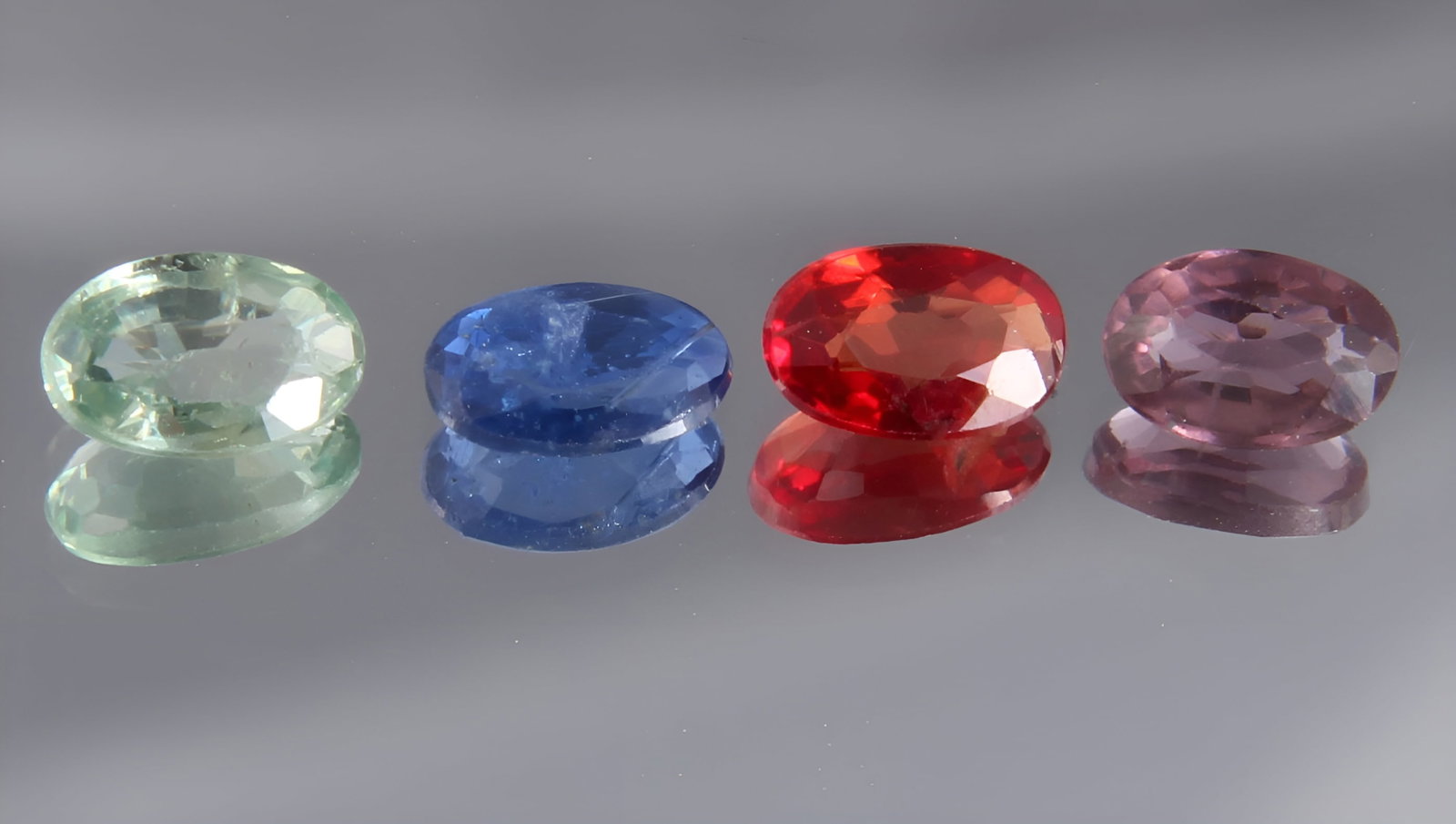 Lovely 0.92 Cts Natural Sapphire LOt: Gemstone : Natural Sapphire Shape and cut : Oval Cut Origin : Srilanka Weight : 0.92 carats Measurements : 5x3 mm, 4.34x2.95x1.94 mm Color : Red, Blue, Green, Pink Number of Stone : 4 Transparency : T
