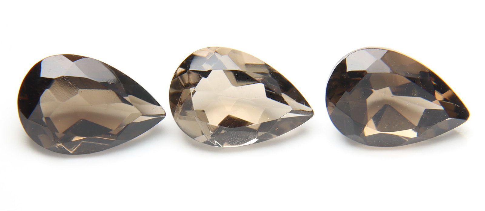 Beautiful 8.81 Cts Natural Smoky Quartz Pair: Gemstone : Natural Smoky Quartz Shape and cut : Pear Cut Weight : 8.81 Carats Measurements : 12x8 mm Number of Stone : 3 Color : Brown Transparency : Transparent Treatment : Heated (Natural citrine, g