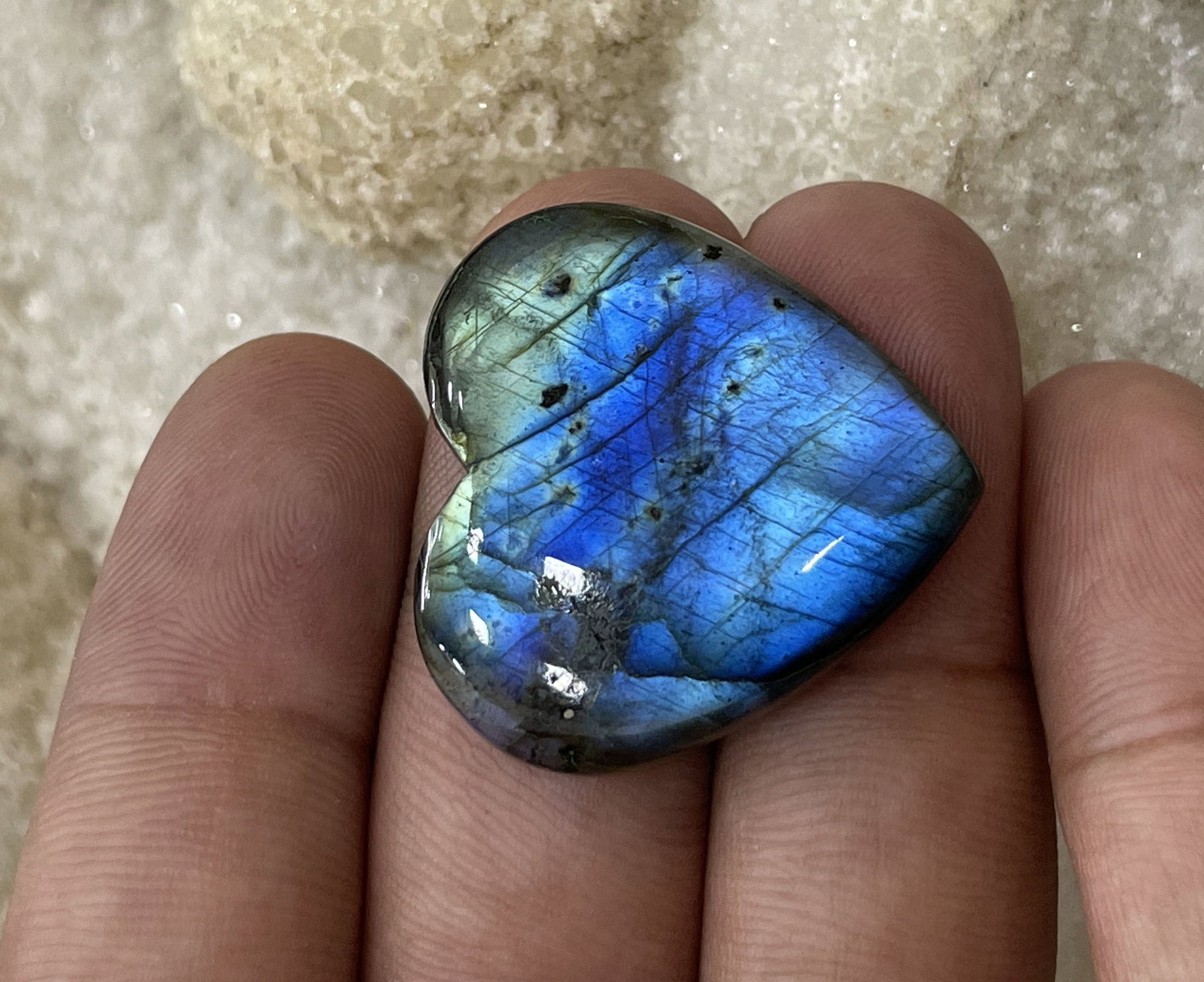 Blue 35.87 Cts Natural Labradorite: Gemstone : Natural Labradorite Shape : Heart Cabochon Weight : 35.87 carats Measurements : 25x27 mm, Color : Black Transparency : Opaque Treatment : None Origin : Madagascar Shipping-: Flat rate of $7