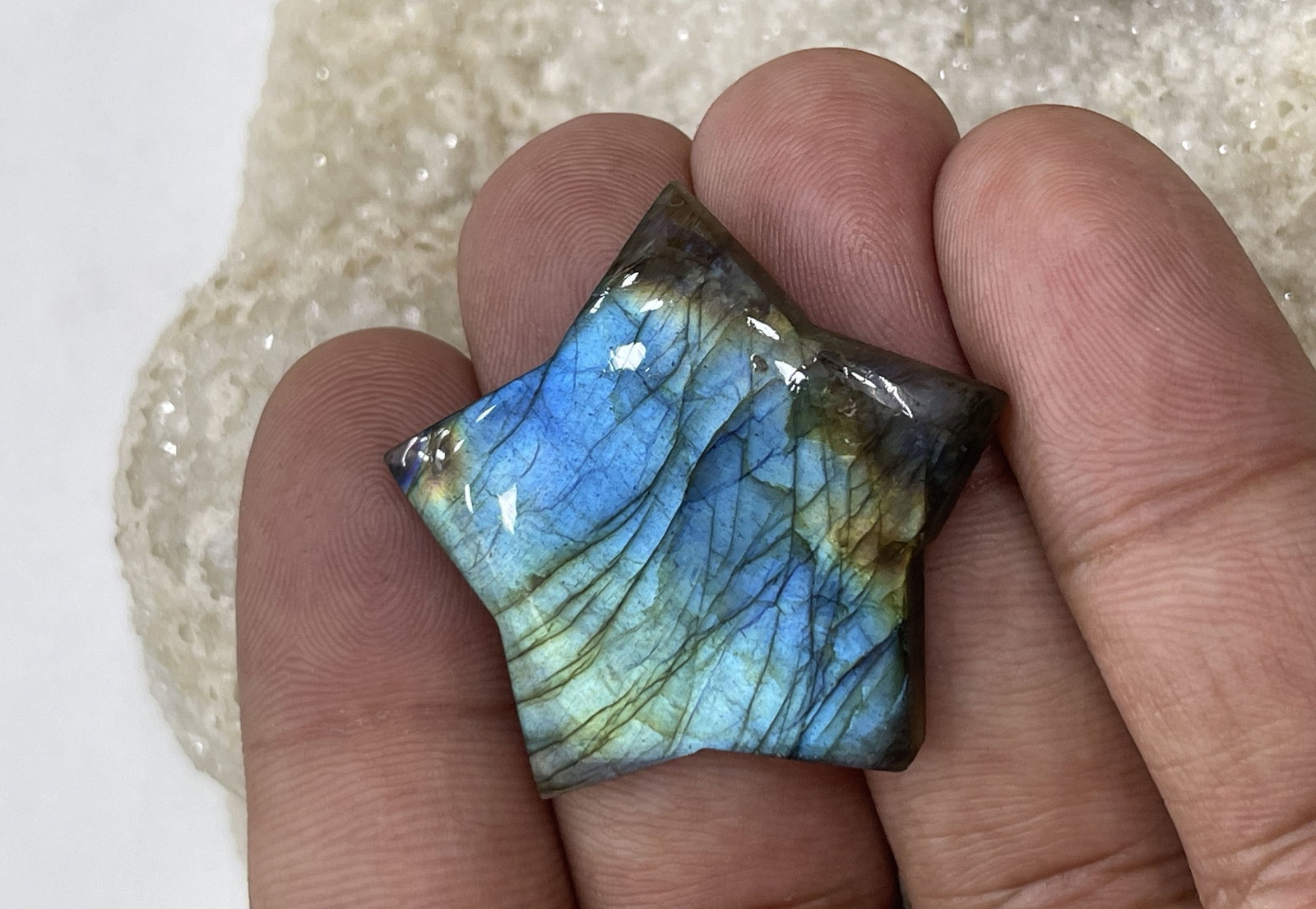 Beautiful 40.45 Cts Natural Labradorite: Gemstone : Natural Labradorite Shape : Star Cabochon Weight : 40.45 carats Measurements :28x28 mm, Color : Black Transparency : Opaque Treatment : None Origin : Madagascar