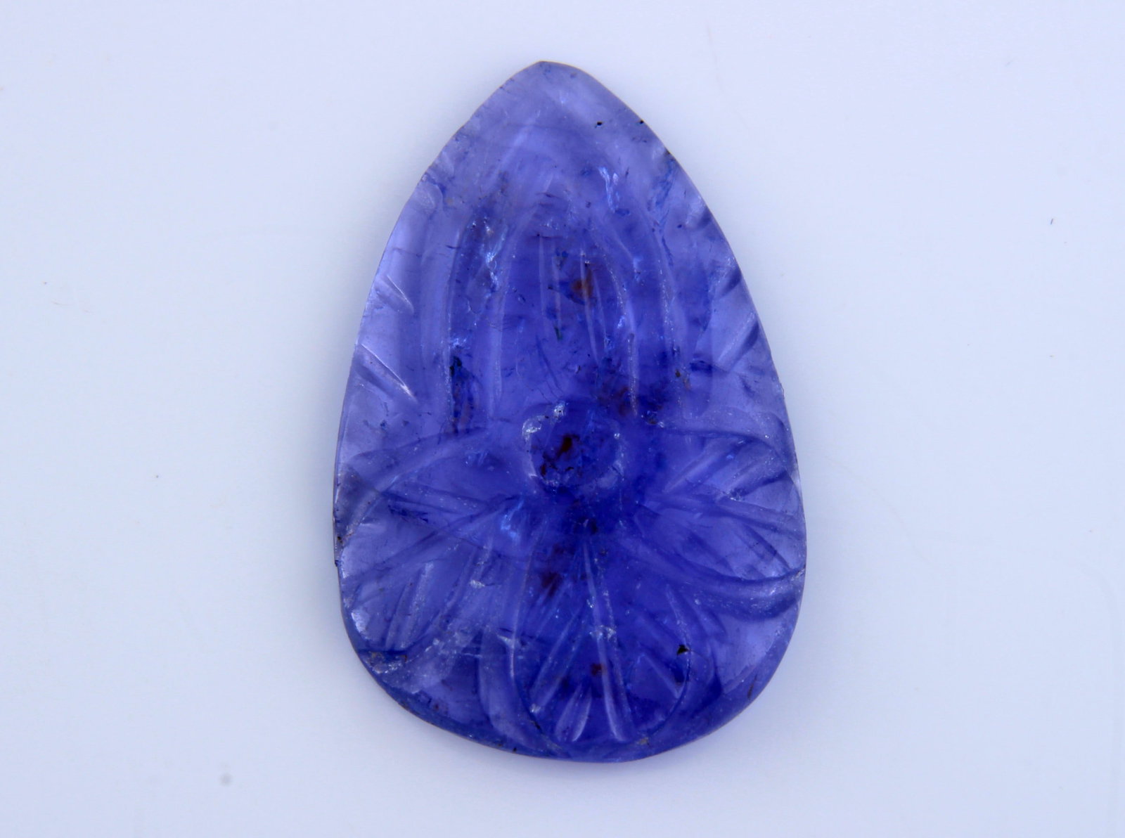 Beautiful " Natural Carving Tanzanite " 7.62 Cts Natural Carving Tanzanite: Gemstone : Natural Carving Tanzanite Origin: Tanzania Weight : 7.62 carats Dimensions : 22.53x14.21x2.75 mm Shape/Cut: Pear Carving Cabochan Color : Violet Transparency: transparent Treatment: none Sh