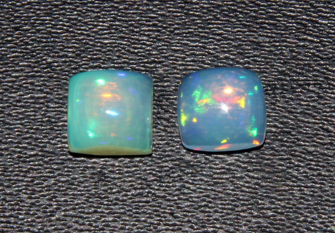 Beautiful " Fire Ethiopian Opal " 1.00 Cts Natural Ethiopian Opal Lot: Gemstone : Natural Opal Shape and cut : Square Cabochon Weight : 1.00 Carats Dimensions: 5x5 mm, 5.50-5.49x2.81 mm Color : White, Number of Stone : 2 Transparency : Translucent Treatment : No Origin :