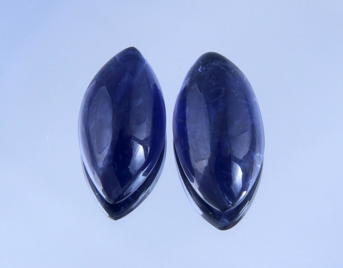 Awesome " Natural Iolite Violet " 2.43 Cts Natural Iolite Lot: Gemstone : Natural Iolite Shape and cut : Marquies Cabochan Weight : 2.43 carats Dimensions: 10.44x5.46x3.16 mm , 10x5 mm Color : Violite Number of Stone : 2 Transparency : Transparent Treatment : No