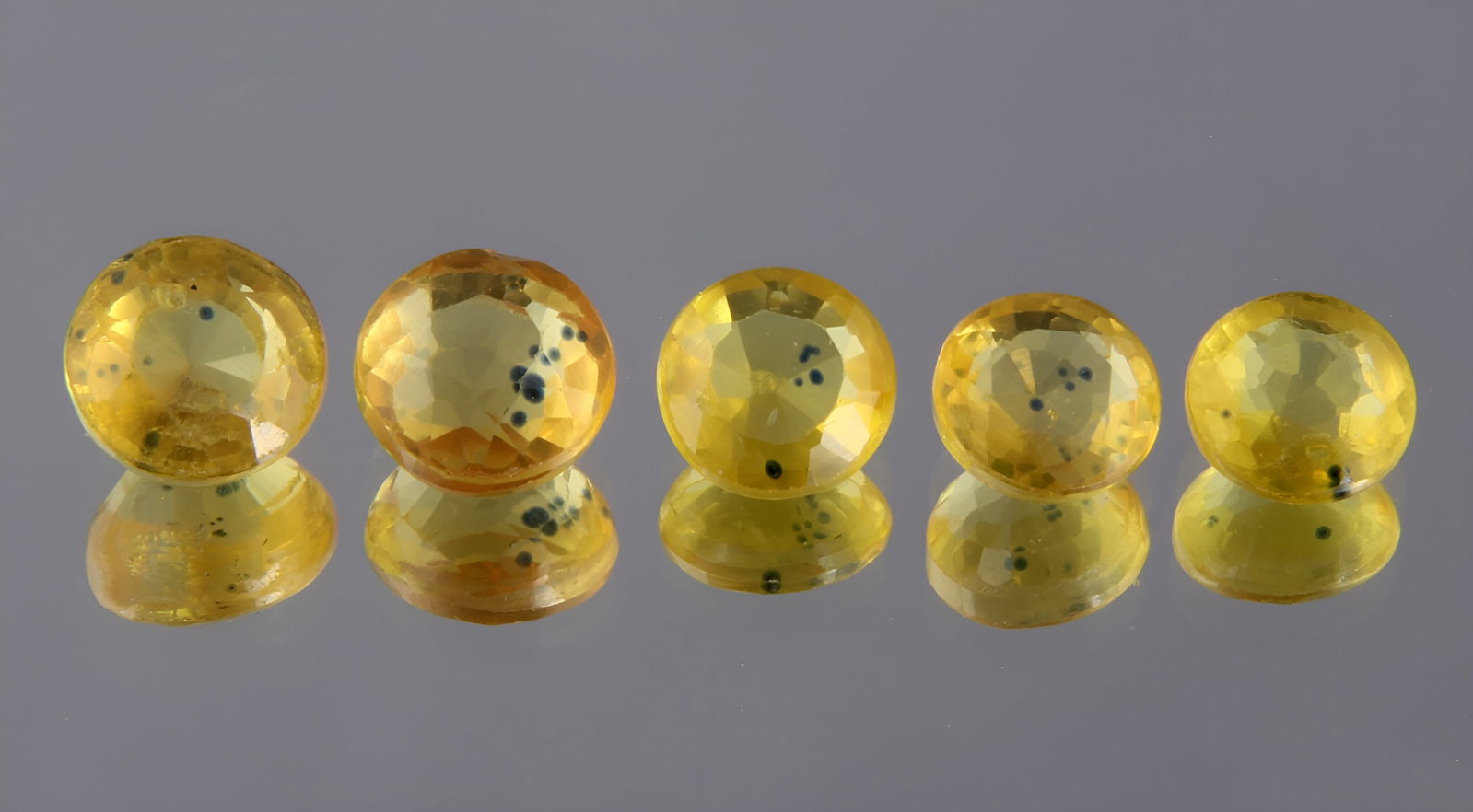 Beautiful "Natural Sapphire" 2.29 Cts Natural Sapphire Set: Gemstone : Natural Sapphire Shape / cut : Round Cut Origin : Srilanka Weight : 2.29 carats Dimensionsnts : 4.58-4.51x2.87 mm, 4x4 mm Color : Yellow Number of Stone : 5 Transparency: Transparent Treatm