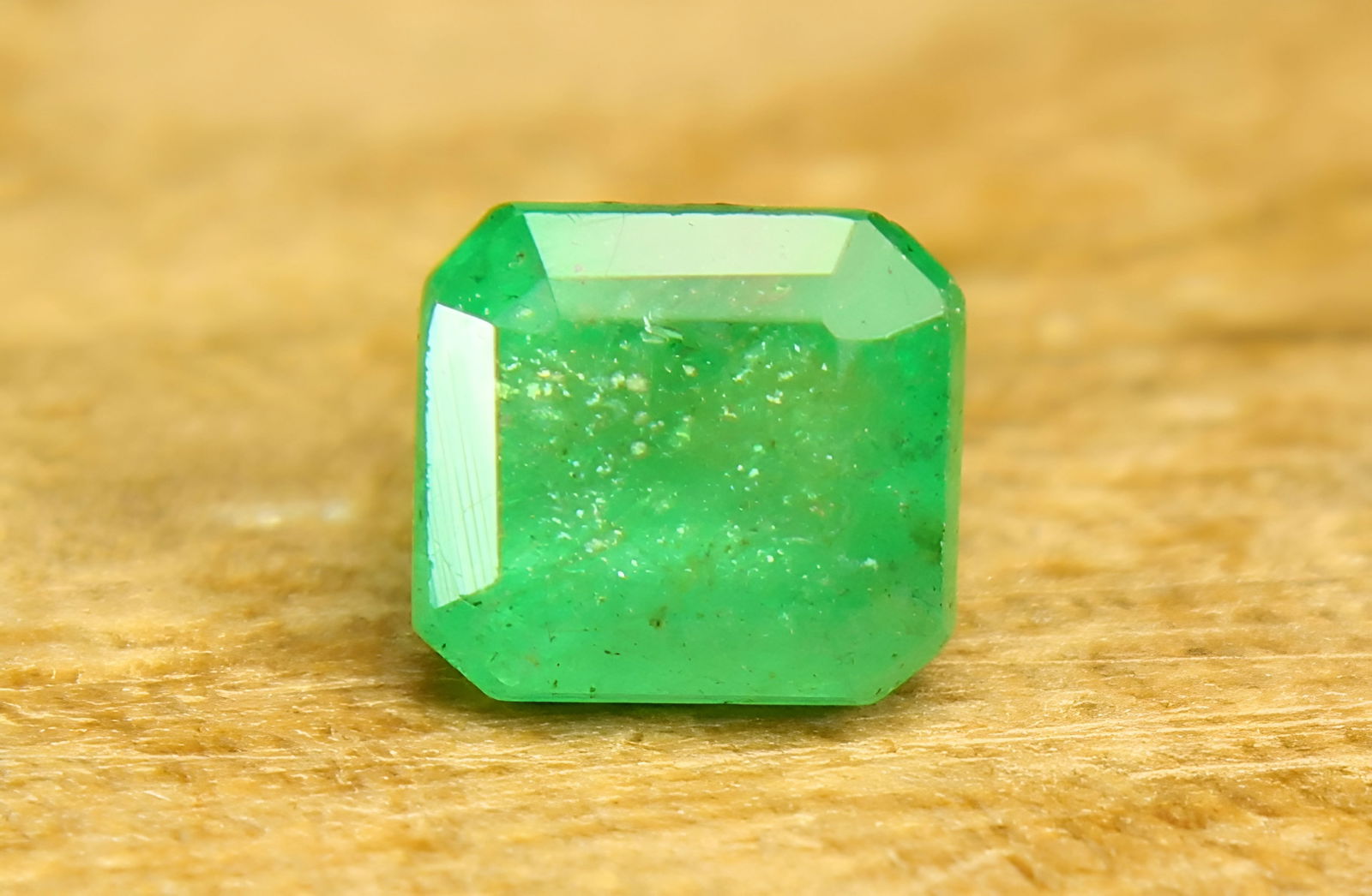 Lovely 0.64 Cts Natural Emerald: Gemstone : Natural Emerald Origin : Zambia Weight : 0.64 carat total Dimensions : 4.90-4.46x3.91 mm, Shape / Cut : Square Cut Color : Green Transparency : Transparent Clarity Some Natural Inclusions a