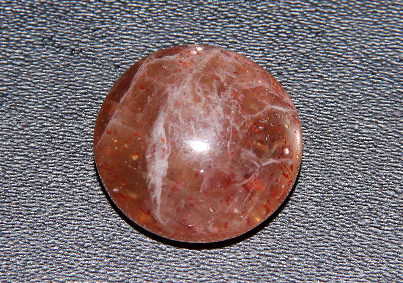 Fabulous 13.61 Cts Natural Sunstone: Gemstone : Natural Sunstone Shape / cut : Round Cabochon Origin : Africa Weight : 13.61 carats Dimensions : 15.74-15.56x7.90 mm , Color : Orange Transparency: Opaque Treatment : None Clarity : VVS Shi