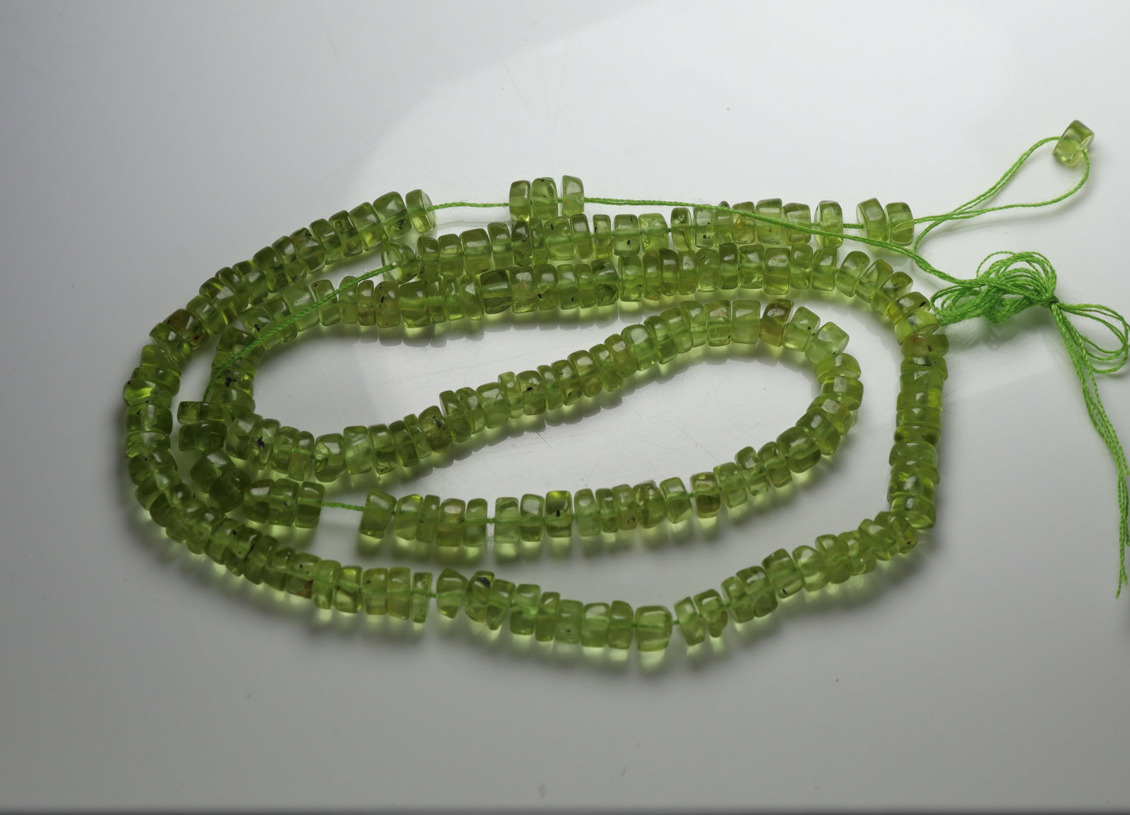 Fabulous 77.57 cts Natural Peridot: Gemstone : Natural Peridot Weight : 77.57 carat Shape / Cut : Beads Cabochan Dimensions : 4x4 mm Color : Green Origin : India Treatment : No Treatment Transparency : Transparent" Shipping-: Flat rate 