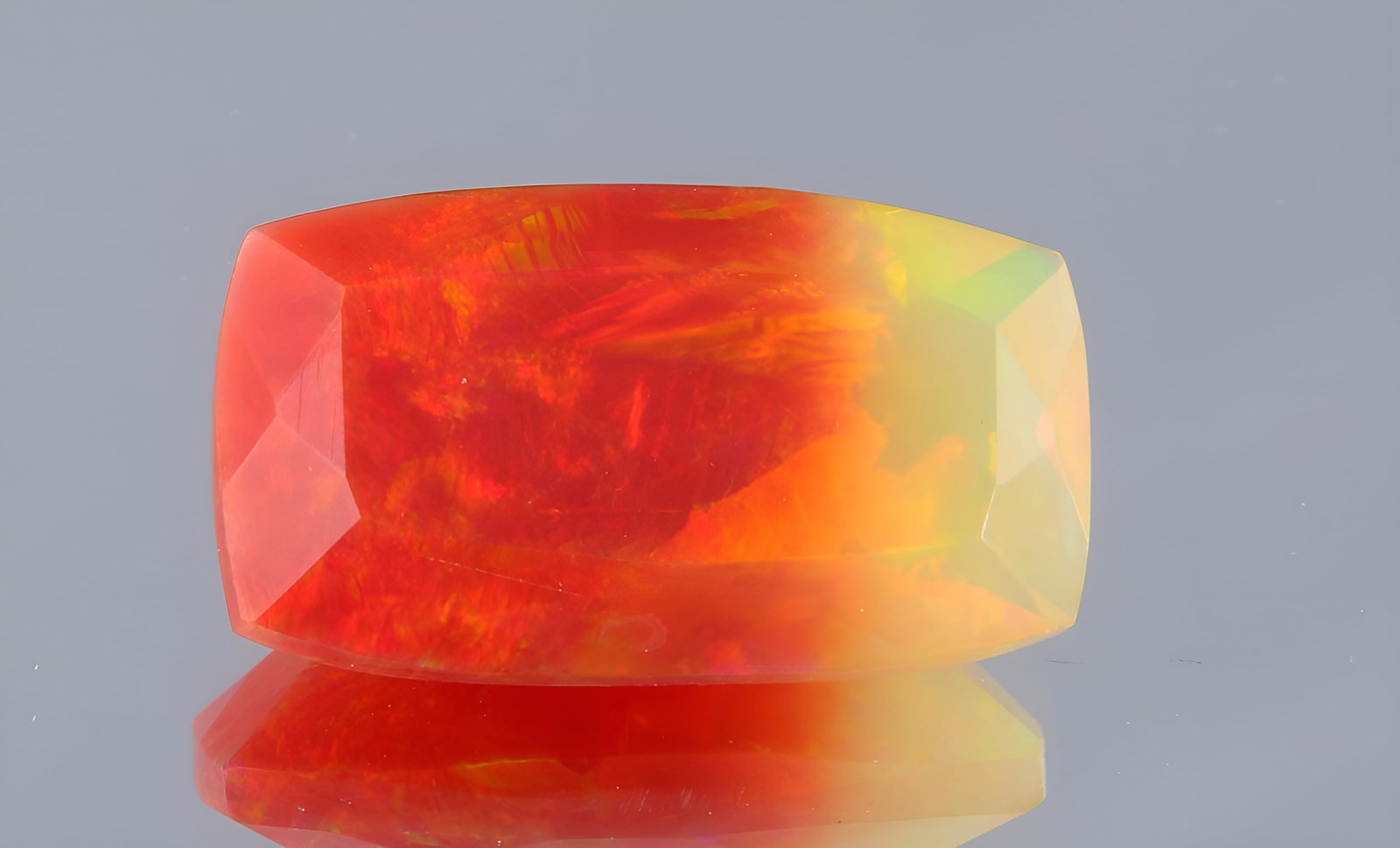 Beautiful 3.02 Cts Natural Bi- Colour Ethiopan Opal: Gemstone : Natural Bi Colour Ethiopian Opal Shape and cut : Rectengular Cut Weight : 3.02 CaratsMeasurements : 14x8 mm Color : Blue, Pink Transparency : Transparent Treatment : Dye Origin : Ethiopian 