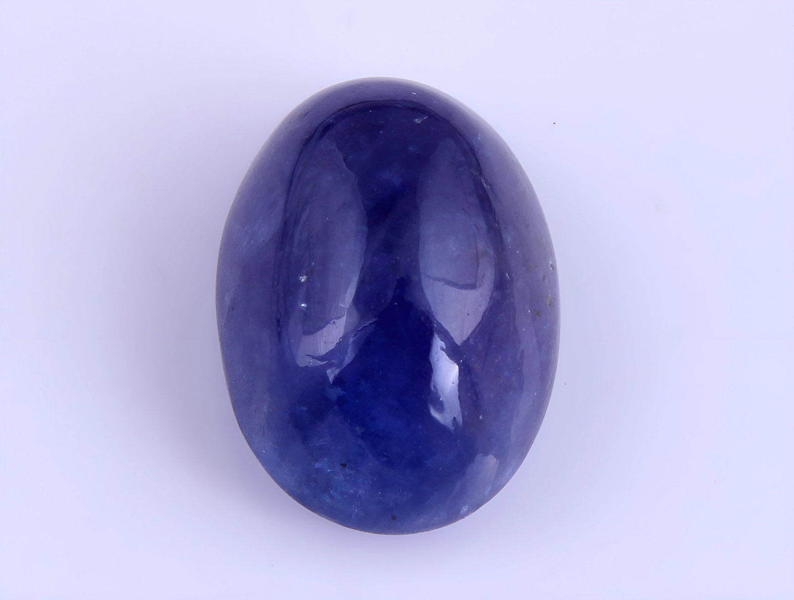 Gorgeous 5.12 Cts Natural Tanzanite: Gemstone : Natural Tanzanite Origin: Tanzania Weight : 5.12 carats Dimensions : 11.57x8.46x5.98 mm Shape /Cut: Oval Cabochan Color : Violet Transparency : transparent Treatment : none Shipping-: Flat 