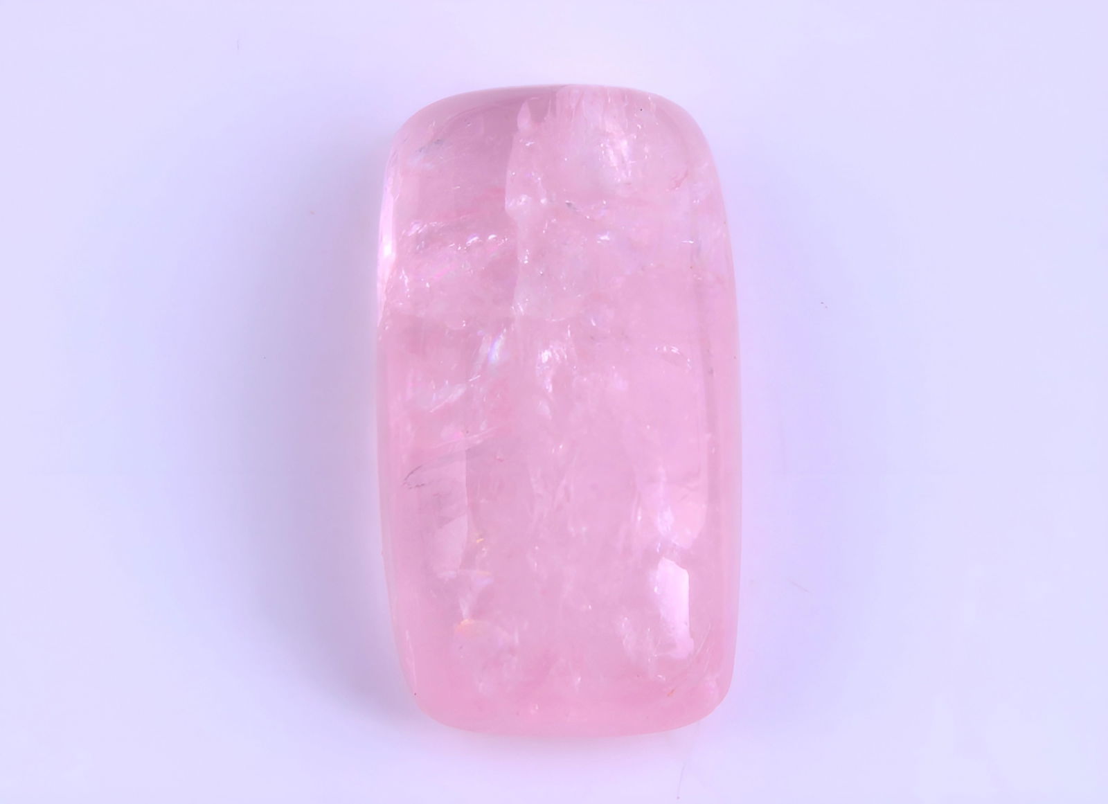 Lovely 8.43 cts Natural Morganite: Gemstone : Natural Morganite Shape and Cut : Rectengular Cabochon Weight : 8.43 caratsMeasurements : 16.70x9.10x5.90 mm Color : Peach Transparency : Transparent Treatment : No Treatment Origin : India