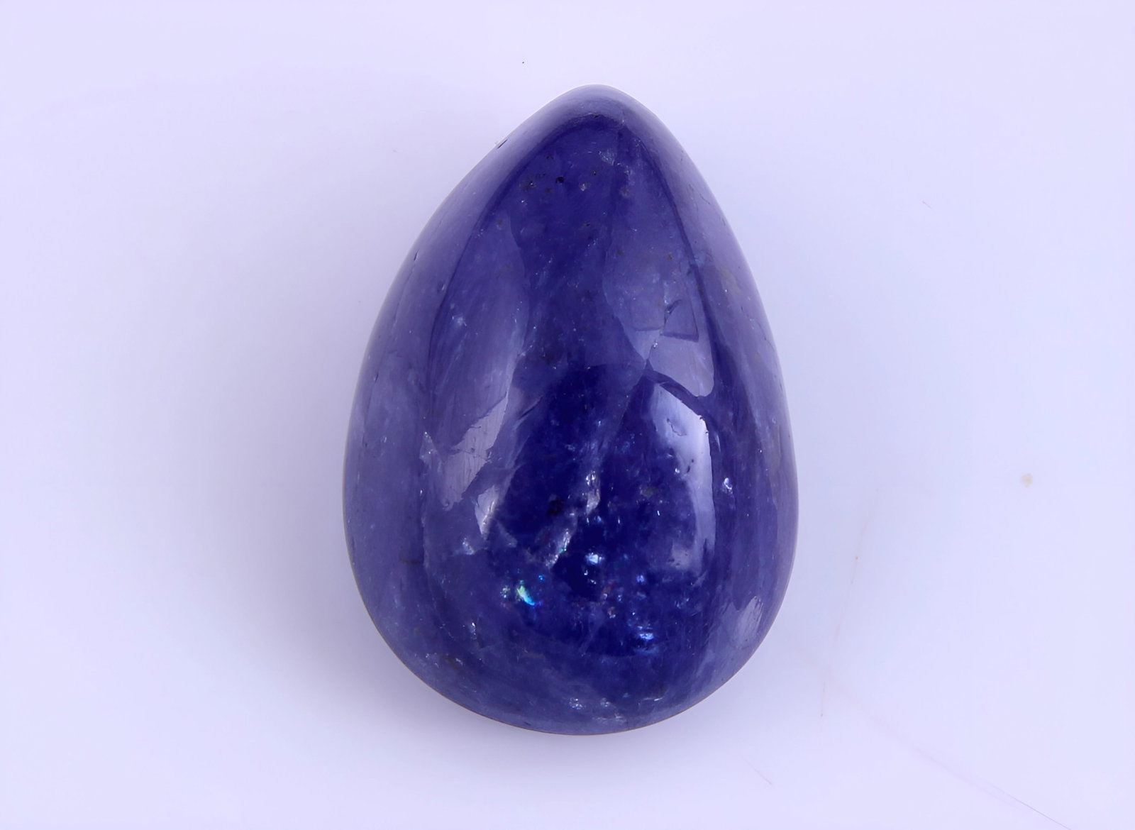 Lovely 11.95 Cts Natural Tanzanite: Gemstone : Natural Tanzanite Origin: Tanzania Weight : 11.95 carats Dimensions : 16x11 mm Shape /Cut: Pear Cabochan Color : Violet Transparency : transparent Treatment : none Shipping-: Flat rate of $
