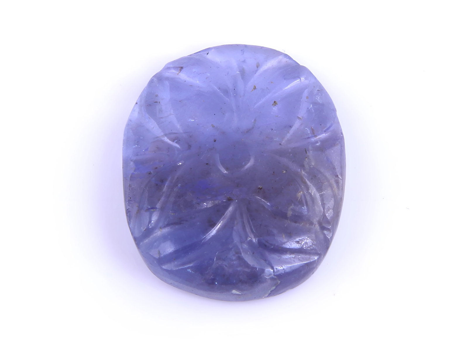 AA Color Natural Tanzanite Carving - 7.15 Cts: Gemstone : Natural Tanzanite Origin: Tanzania Weight : 7.15 carats Dimensions : 16.33x13.31x3.52 mm Shape /Cut: Oval Carving Color : Violetish Blueish Blue Transparency : transparent Treatment : Tradt