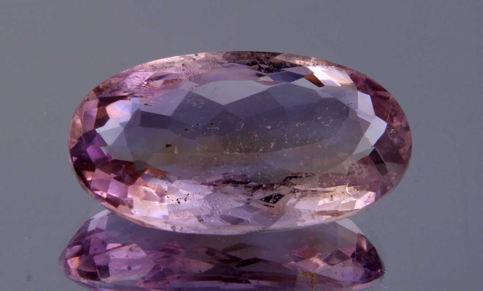 Marvellous " Natural Rose De France Amethyst " 15.64 cts Natural Rose De France Amethyst: Gemstone : Natural Rose De France Amethyst Origin : Brazil Weight : 15.64 carats Dimensions: 23x12 mm Shape /Cut : Oval Cut Colour: Purple Transparency : Transparent Treatment : none Clarity: VVS Ship